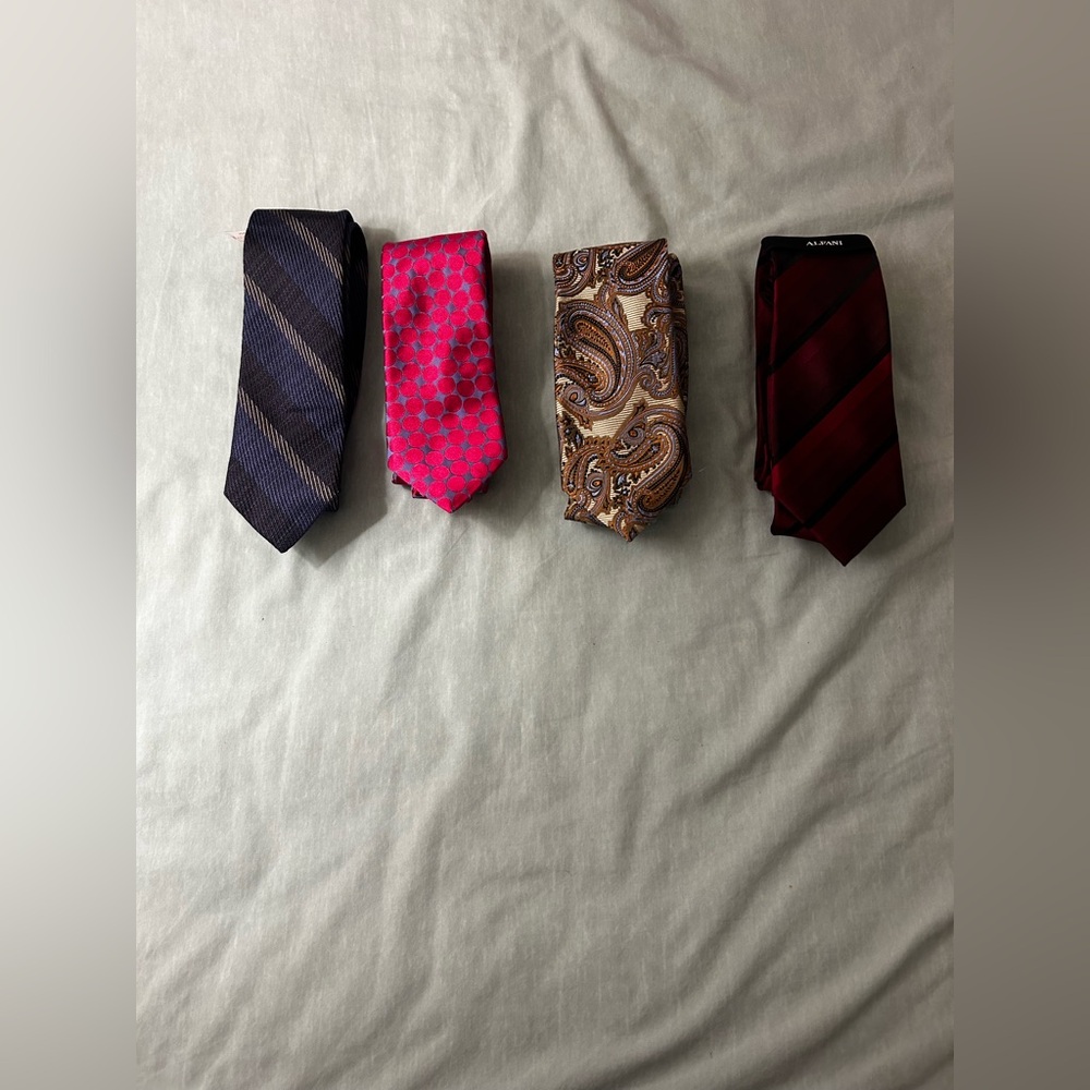 Bundle of four ties. All new with tags.